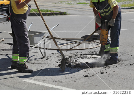 Asphalt demolishing, worker and jackhammer 31622228