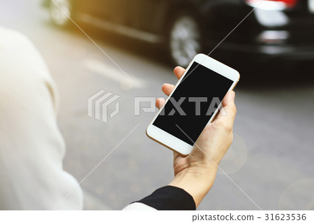 Woman using smart phone by the street. Woman using smart phone by the street. 31623536