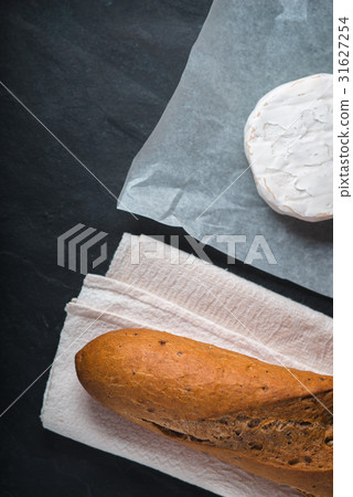 Brie cheese with bread on the stone background 31627254