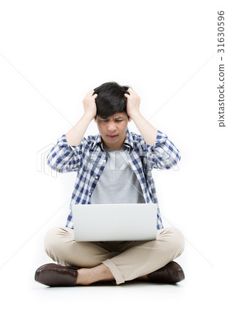 Asian upset man sitting on the floor with laptop 31630596