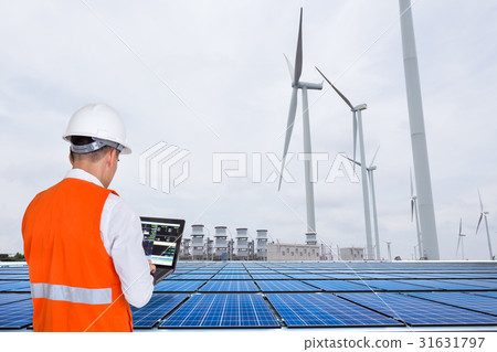 Engineers working at wind turbine power station Engineers working at wind turbine power station 31631797