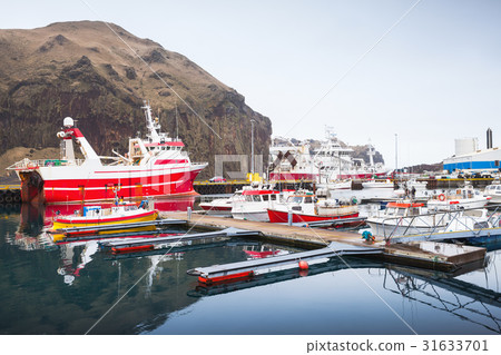 Fishing boats in port of Vestmannaeyjar Fishing boats in port of Vestmannaeyjar 31633701