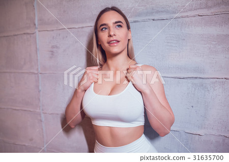 Sexy blonde woman with huge breast in a white top 31635700