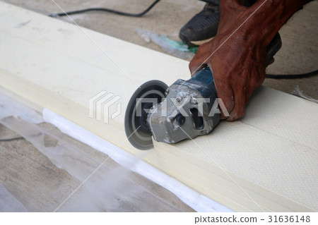Electric circular saw cutting the artificial wood. Electric circular saw cutting the artificial wood. 31636148