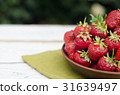 Strawberries ripe red on wooden table 31639497