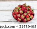 Strawberries ripe red on wooden table 31639498