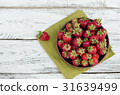 Strawberries ripe red on wooden table 31639499