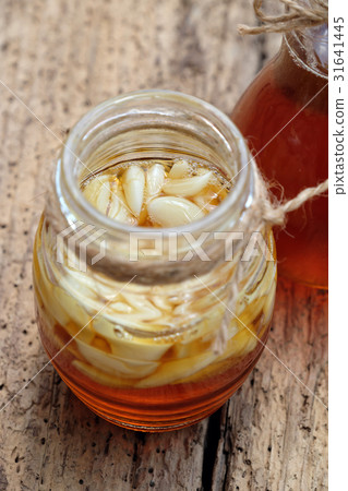 garlic in bee honey, remedy skin care 31641445