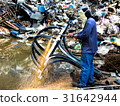 A worker is cutting steel with oxygen gas machine 31642944