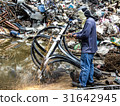 A worker is cutting steel with oxygen gas machine 31642945