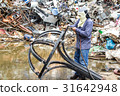 A worker is cutting steel with oxygen gas machine 31642948