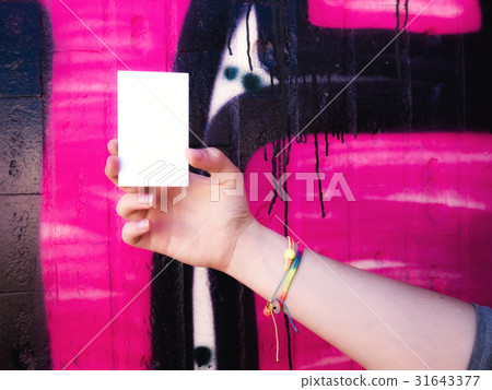 Female hand holding blank white business card. Female hand holding blank white business card. 31643377