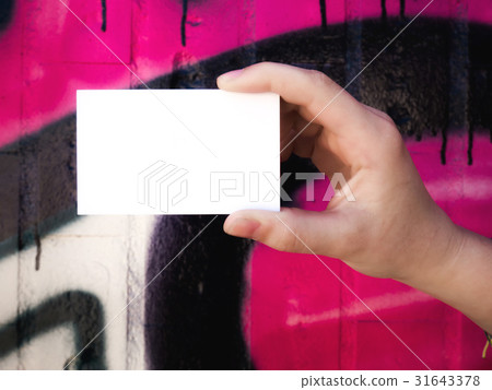 Female hand holding blank white business card. Female hand holding blank white business card. 31643378