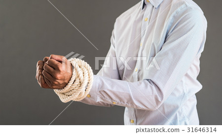 A businessman whose hand was tied at the rope A businessman whose hand was tied at the rope 31646314