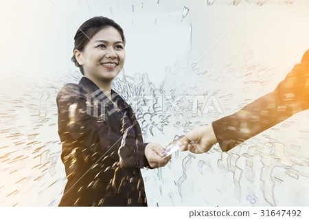 Businesswoman exchanging credit card with crowd Businesswoman exchanging credit card with crowd 31647492