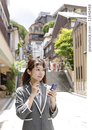 A young woman enjoying Ikaho (business woman style) 31648466