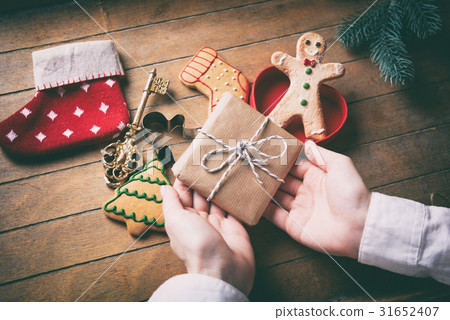 hands holding gift box and sock 31652407