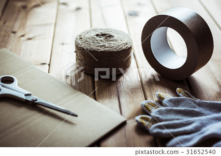 Cardboard box and gum tape 31652540