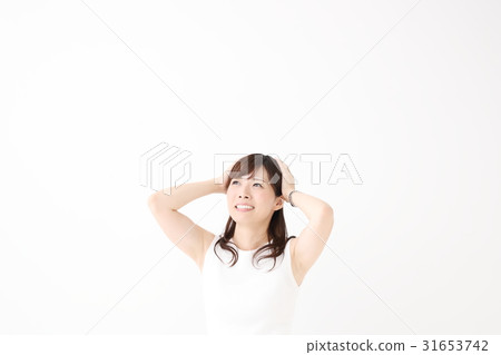 A woman holding a head A woman holding a head 31653742