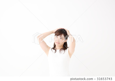 A woman holding a head A woman holding a head 31653743