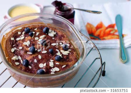 Marmalade pudding cake with blueberry and custard Marmalade pudding cake with blueberry and custard 31653751