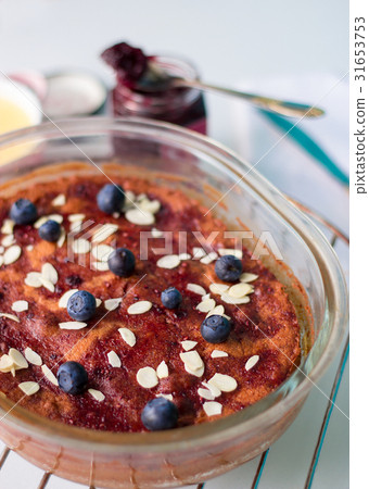 Marmalade pudding cake with blueberry and custard Marmalade pudding cake with blueberry and custard 31653753