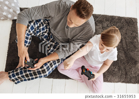 Dedicated cute gamers focused on the game 31655953