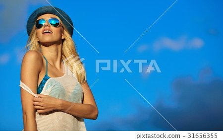 woman relaxing at the sky background . Summer hipster vacations woman relaxing at the sky background . Summer hipster vacations 31656355
