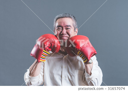 Senior men taking fighting poses Senior men taking fighting poses 31657074