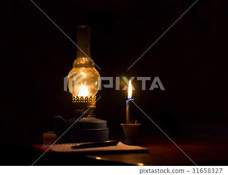 Kerosene lamp yellow flame and a candle light Kerosene lamp yellow flame and a candle light 31658327