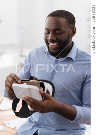 Delighted nice man being exited about new Delighted nice man being exited about new 31658525