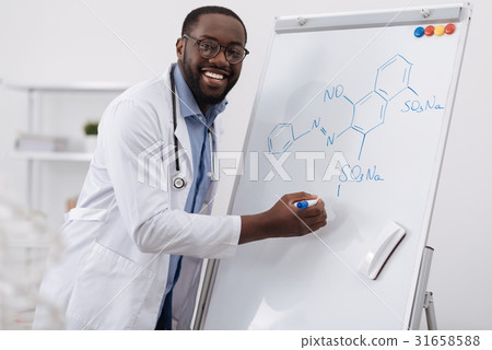 Delighted smart man studying organic chemistry 31658588