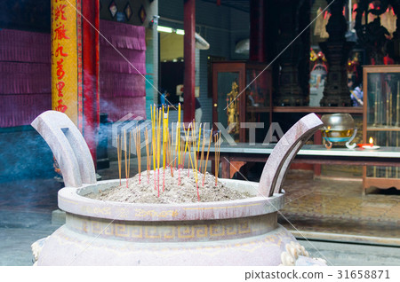 Burning incense sticks Burning incense sticks 31658871