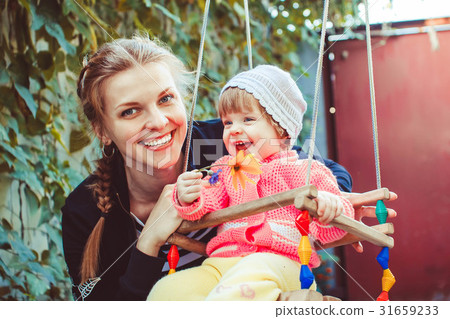 Child on the swing 31659233
