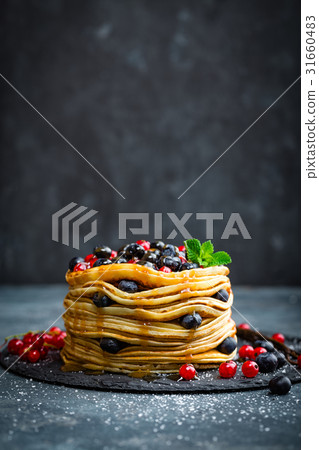 Pancakes with fresh berries and maple syrup 31660483