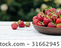 Strawberries ripe red on wooden table 31662945