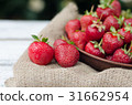 Strawberries ripe red on wooden table 31662954