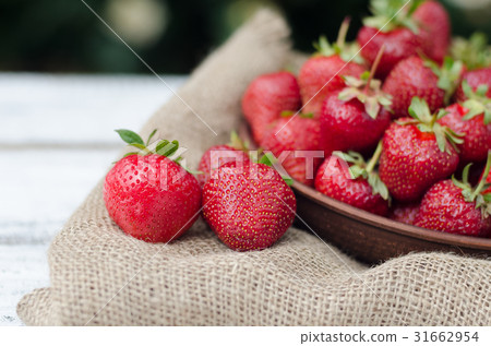 Strawberries ripe red on wooden table Strawberries ripe red on wooden table 31662954