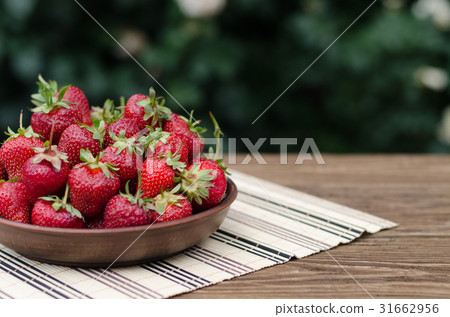 Strawberries ripe red on wooden table 31662956
