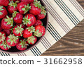 Strawberries ripe red on wooden table 31662958