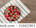 Strawberries ripe red on wooden table 31662961