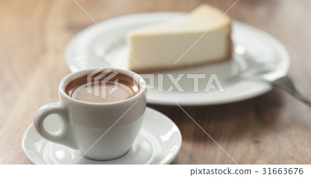 espresso and cheesecake on table 31663676