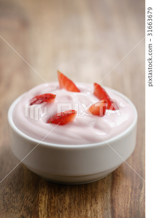 organic strawberry yogurt on wooden table organic strawberry yogurt on wooden table 31663679