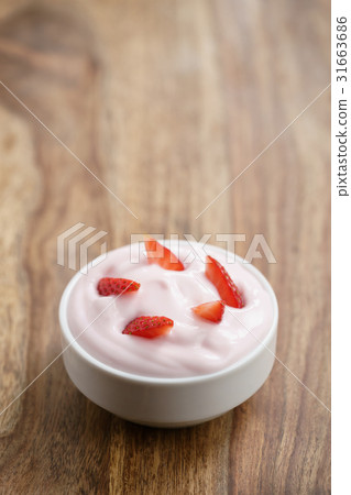 organic strawberry yogurt on wooden table organic strawberry yogurt on wooden table 31663686
