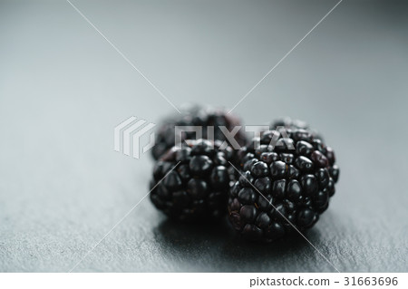 ripe organic blackberries on slate background 31663696