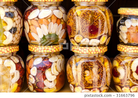 Homemade honey with dried fruits and nuts on the 31663796