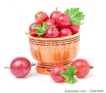 red gooseberries with leaf in wooden bowl isolated 31664090