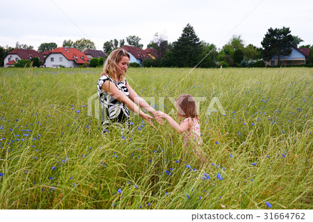 Mother and doughter outdoors in summer time 31664762