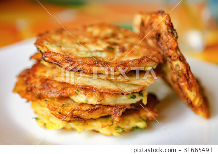 Stack of fried vegetable fritter made of zucchini Stack of fried vegetable fritter made of zucchini 31665491