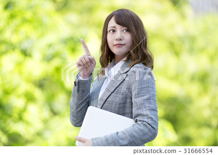 Female finger pointing with laptop recommended Female finger pointing with laptop recommended 31666554